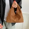 Bolso pequeño minimalista coreano de invierno exquisito, de gamuza para el día a día, de terciopelo para ir al trabajo, moda femenina 2026 estilo nuevo, bolso de mano versátil de nicho