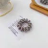 El scrunchie de cordón de teléfono trenzado de color contrastante de la celebridad de internet coreana Morandi es simple, muy elástico y duradero.