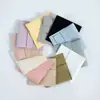 Suministro exclusivo transfronterizo de bolsas de almacenamiento para joyería de microfibra, bolsas tipo sobre con botón de presión de doble cara de terciopelo, hechas a medida con logo en relieve