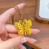 Wei Xue con esmalte dorado arena mariposa de seda hueca colgante collar mariposa sombra de mariposa tres dimensiones fu mariposa cadena de suéter mujer