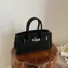 Bolsa de Mão de Platina Estilo Transfronteiriço para Mulheres 2026 Nova Moda de Verão Versátil Ombro Transversal Bolsa Kelly