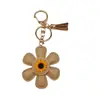 Colgante de Bolsa de Girasol de Dibujos Animados Venta Caliente Accesorios Miu Llavero de Cuero Funda de Teléfono de Girasol Decoración de Bolsa