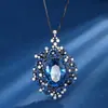 2024 nueva joyería Huabi retro europeo y americano huevo tesoro de color simulación colgante hueco oro negro piedra principal 12*16