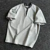 Camiseta Xadrez Patchwork Manga Curta Estilo Americano Falso Duas Peças Direto da Fábrica para Homens e Mulheres Verão Nova Marca Tendência Versátil Solta