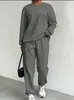Conjunto de Duas Peças Europeu e Americano Transfronteiriço Primavera e Outono 2025 Novo Top Feminino de Tricô Torcido com Mangas Longas e Gola Redonda e Leggings