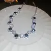 Traje de collar y pendientes de diamante ovalado europeo y americano exagerado luz de lujo alta gama cadena de clavícula nicho moda joyería al por mayor