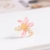 Nuevo broche de flores pequeñas de moda de estilo japonés y coreano, elegante, elegante, elegante, floral, antiexposición, hebilla, cuello, tapeta, accesorios de circonita
