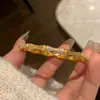 Pulsera de bambú chapada en oro para mujer, anillo liso de oro cepillado de lujo ligero, pulsera de plata de alta gama estilo chino con medio diamante, regalo para novia