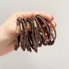 Estampado de leopardo cuadros banda de goma plana banda para el pelo mujeres atar cuerda para la cabeza Corea del Sur nuevo coleta simple temperamento estuche de cuero al por mayor