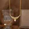 Collar de acero y titanio con doble anillo de amor para mujer, oro de 18 quilates, diseño de nicho de lujo ligero, sensación de elegancia, cadena de clavícula de celebridades de Internet, accesorios