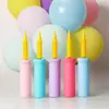 Fabricantes directos al por mayor en stock bomba inflable de mano Macaron bomba inflable de plástico bidireccional bomba para fiesta de bodas