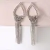 Versión coreana de fábrica directa otoño e invierno Nuevo diamante gota hueco borla moda colgante pendientes pendientes E319