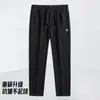 Pantalones de otoño gruesos para hombre con elasticidad en cuatro direcciones, cremallera, múltiples bolsillos, cintura elástica, corte recto holgado, estilo jogger