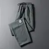 Pantalones Casuales Cruzados de Seda de Hielo para Hombre, Estilo Delgado de Verano, Largo de Nueve Puntos, Corte Holgado, Marca de Moda, Elegantes, Pierna Recta, Pantalones Largos Transpirables