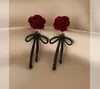 Pendientes de botón con lazo festivo de terciopelo rojo para mujer, pendientes elegantes y dulces con forma de flor y borla larga, pendientes de otoño e invierno