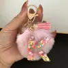 Suministra y Vende Llaveros con Alfabeto de 26 Letras en Forma de Corazón de Colores con Pompoms y Borlas, Colgantes para Llaves para Bolsos de Mujer