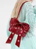 Bolsa de Ombro Sweet Cool Spice Girl de Alto Valor Feminina 2025 Verão Nova Moda Bolsa de Rebites Distinta Bolsa de Axila com Laço