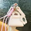 Chaveiro Porta-Moedas de Couro Transfronteiriço, Acessório de Espelho Pequeno Exquisito e Fofo em Formato de Flor, Pingente para Bolsa de Fones de Ouvido, Atacado de Comércio Exterior