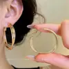 Brincos redondos europeus e americanos de várias camadas torcidas, moda nicho de alta qualidade, brincos simples e versáteis do dia a dia para mulheres