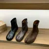 Zapatos de pezuña de cerdo con punta dividida y fondo plano botas de tobillo negras botas para mujer 2026 adelgazantes marrones con faldas primavera y otoño botas sencillas