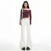 Jeans negros de tiro bajo acampanados para mujer, forrados de felpa, nuevo estilo otoño/invierno 2026, diseñados para cubrir las caderas y ocultar imperfecciones, con un ajuste que no se pega.