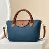 Bolso pequeño de nicho versátil para mujer 2023 nuevo bolso de hombro texturizado estilo western bolso de mensajero de alta calidad moda bolso de mano