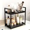 Estante de almacenamiento de escritorio de doble capa de venta caliente transfronterizo Estante de almacenamiento multifuncional perforado sin estante Estante para perfume y cosméticos