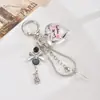 Cadena Personalizada Nueva de Hueso de Serpiente de Metal Colgante Decorativo para Bolso Creativo Cara Sonriente Cuadrada Llavero con Colgante de Perlas