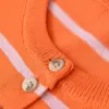 Ropa de mujer al por mayor transfronteriza estilo europeo y americano primavera nueva top de punto a rayas de bloques de color de manga larga y cuello redondo