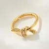 Anillo Abierto Popular Exquisito de Nudo de Cuerda con Circonita Microincrustada de Cobre, Chapado en Oro Real, Anillo Ajustable de Dedo Índice de Gama Alta de Nicho