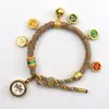 Pulsera tejida a mano estilo Tíbet con Cinco Deidades de la Riqueza, Pulsera Thangka, Colgante Ojo del Dharma del Dios de la Riqueza, Pulsera de Hilo Rojo con Cascabel