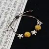 Jingdezhen Navidad Pulsera de Cuerda Trenzada de Cerámica Pulsera de Trébol de Cuatro Hojas Joyería Artística Hecha a Mano Venta al por Mayor Pulseras de Cerámica para Atracciones Turísticas