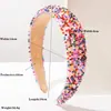 Diadema Heming, un nuevo modelo transfronterizo de estilo europeo y americano, presenta coloridos abalorios de arroz y un diseño ancho de esponja, lo que la convierte en un accesorio para el cabello hermoso, dulce y versátil.