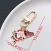 Nuevo KC Dorado/Blanco K Navidad Aceite Dibujo Animado Lindo Llavero Personalidad Creativa Joyería de Navidad Accesorios para Llavero