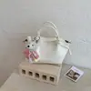 Bolso Cubo Sencillo Estilo Dulce Transfronterizo Versión Coreana Nicho Casual Versátil para Viajar Color Sólido Bolso de Mano con Sensación de Alta Gama Bolso Cruzado