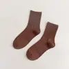 Meias novas femininas cor sólida algodão penteado japonês quatro estações meias cano alto preto e branco JK cor doce meias femininas simples atacado