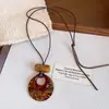 Collar de borlas acrílicas transfronterizo europeo y americano, sensación de lujo ligero y alta gama, cadena para la clavícula con diseño Maillard, joyería de nicho para mujeres