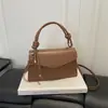 Otoño 2026 Nueva Moda Bolso Cruzado Texturizado Retro Cuadrado Pequeño Bolso de Hombro Simple Versátil para Niña Tendencia al Por Mayor Bolso de Mujer