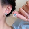 Pendientes de borlas de lujo con diseño de lazo de alta gama para mujer, elegantes pendientes de aleación explosiva con tachuelas para primavera y verano 2025.