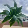 Hojas artificiales de Amazon transfronterizas para decoración: árbol de sangre de dragón simulado, hoja de madera de Brasil, helecho nido de pájaro y hojas artificiales verdes