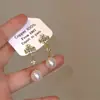 Pendientes Únicos de Perla Rosa Incrustados con Diamantes Super Brillantes para Mujer, con un Toque de Lujo Ligero y de Alta Gama, Pendientes de Botón de Nicho con Borlas Largas