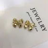 Joyería Hecha a Mano DIY Montura Vacía Aretes de Perla para Mujer Tachuelas Accesorios Exquisito Moño Negro Joyería Comercio Exterior Mayoreo