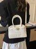 Bolsos de mano de alta gama para mujer, primavera 2026, nuevo estilo, bolsos versátiles, modernos, de nicho, texturizados, con bordado de letras, bolso de hombro