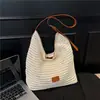 Bolsa de Playa para Vacaciones de Verano para Mujer 2026 Nueva Bolso de Hombro Tote de Paja Tejida Hueca de Gran Capacidad