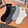 Calcetines de punto con lazo de encaje de lunares, novedad otoño e invierno, calcetines hasta la rodilla de tendencia para estudiantes, calcetines de media pantorrilla para mujer de celebridades de internet japonesas