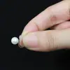 Clip de oreja de resina de cabeza de serpiente nueva japonesa y coreana Clip de oreja de perla invisible No alérgico Agujeros de oreja Accesorios de pendientes diy