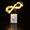 Pila de botón LED caja pequeña blanca color cadena de luces de flores decoración de árbol de Navidad cadena de cobre luz ambiental luces parpadeantes