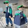 Ropa para Niños Chaqueta Cortavientos con Capucha para Niños Primavera y Otoño Niños Grandes Casual de Primavera Holgada Resistente al Viento Superior Moderna Venta al por Mayor Transfronterizo