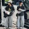 Conjunto de dos piezas estilo caricatura para niñas Zhongda primavera y otoño 2026, sudadera de otoño para niños, capa base moderna para la vuelta al cole