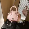 Bolsa de boliche de nicho de comercio exterior para mujer, nuevo bolso de mano pequeño de moda 2026, diseño casual versátil, bolso de hombro y bandolera
